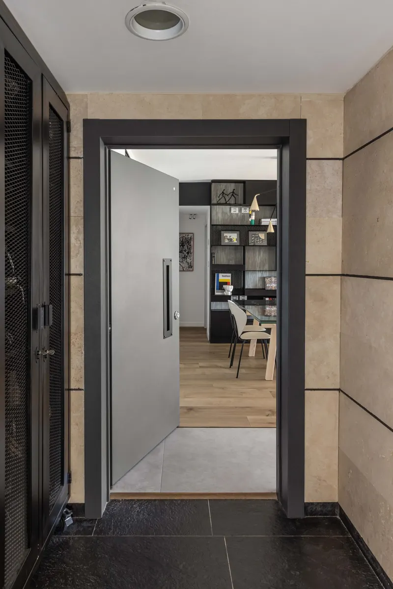 Grey door opening onto a living room